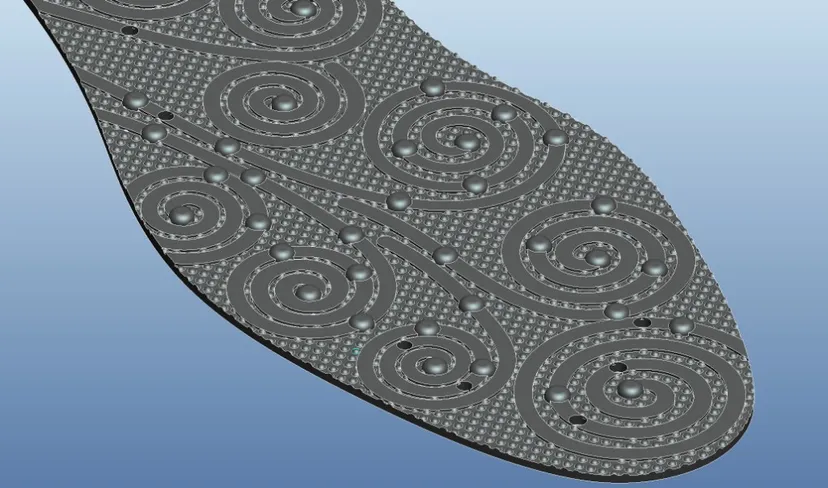 Spiral “cloud” pattern — the entire insole is permanent magnet material, with raised texture across the surface