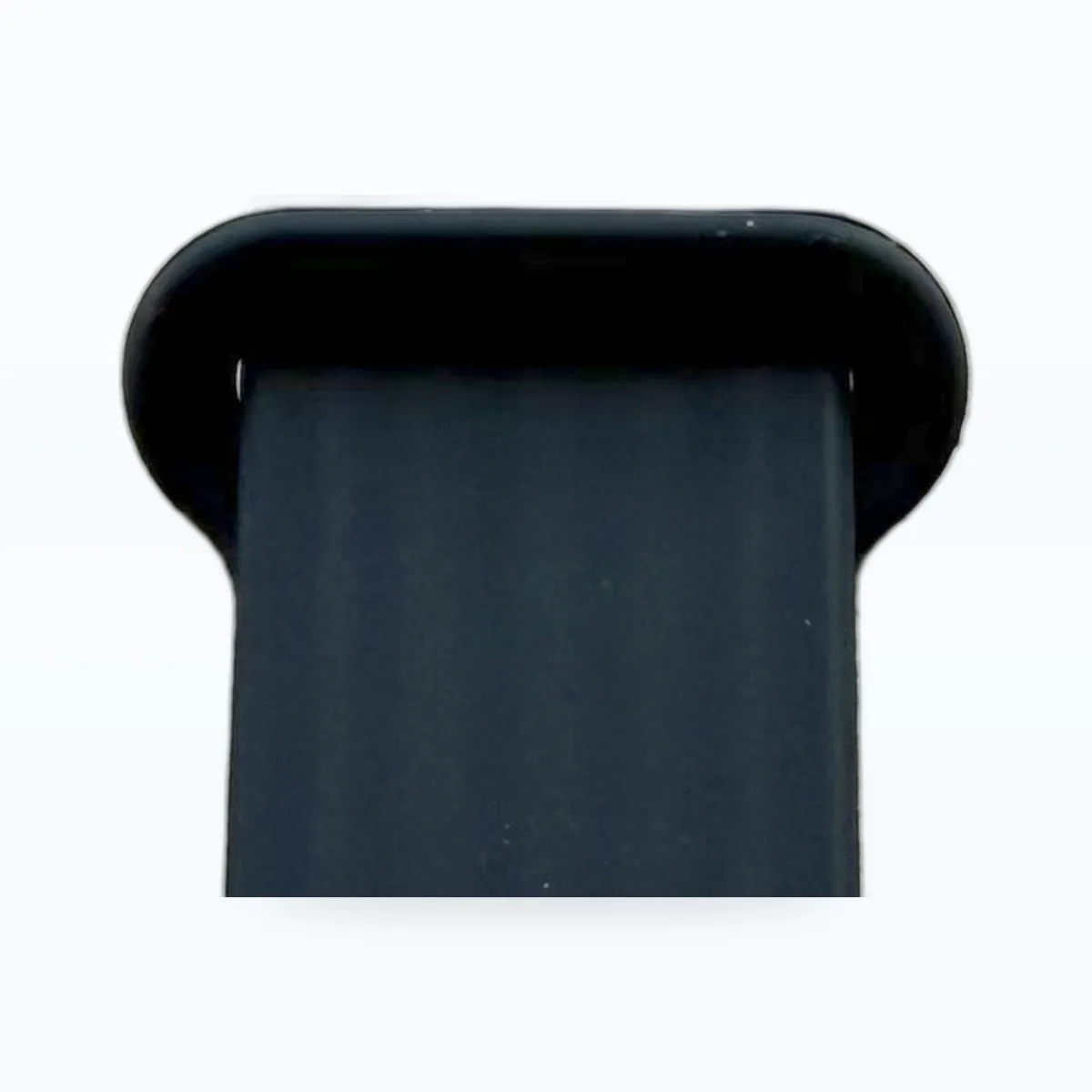 Close-up: the two ends overlap and snap shut — no buckle, no pin holes